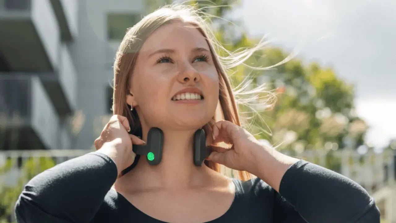 woman wearing Pulsetto device